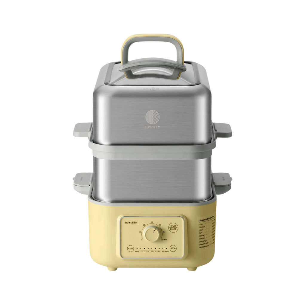 A yellow two-tier food steamer  with a brushed stainless steel upper pot and a cream-colored base, featuring a top handle and a control dial on the front.